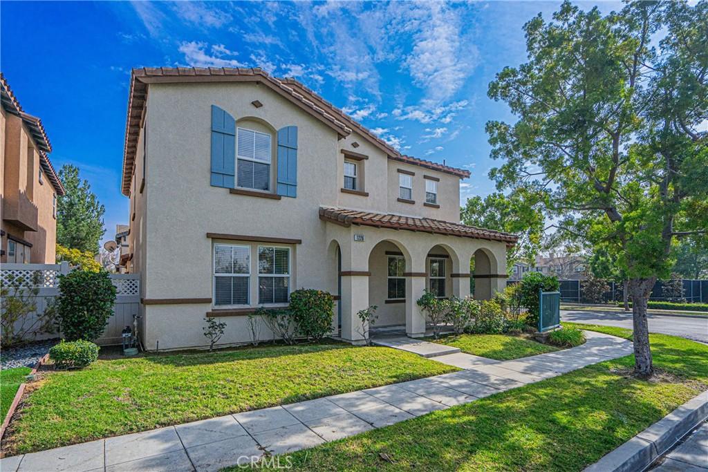 mediterranean / spanish home featuring a front yard