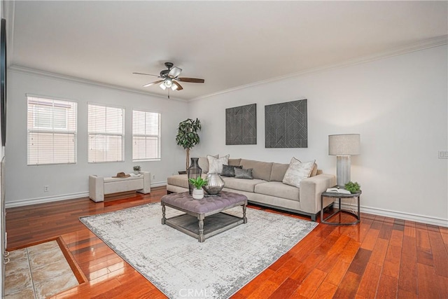 living room with crown molding, wood-type flooring, and ceiling fan