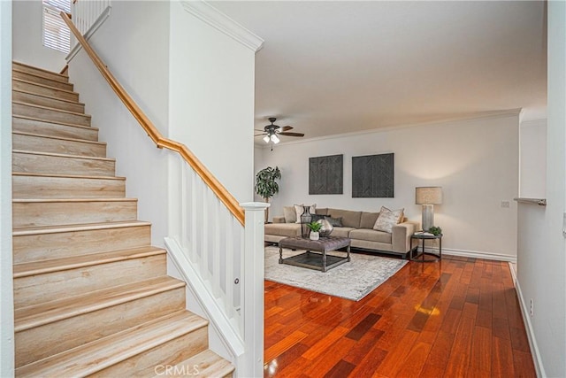 living room with crown molding, hardwood / wood-style flooring, and ceiling fan