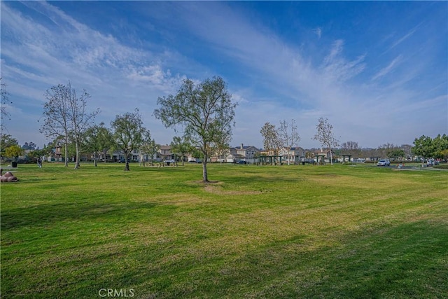 view of home's community featuring a lawn