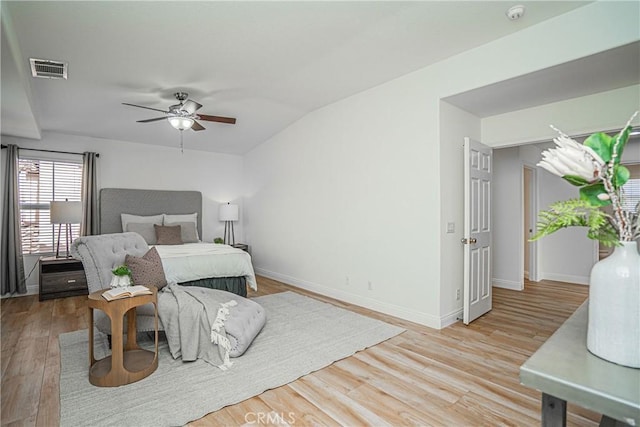 bedroom featuring light hardwood / wood-style floors and ceiling fan