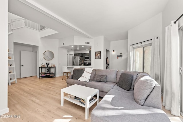 living room with light hardwood / wood-style floors