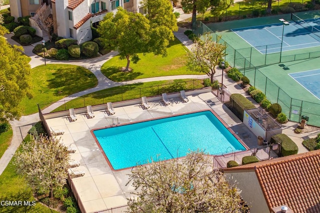 view of pool featuring tennis court