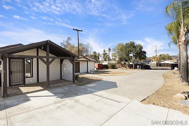 view of home's exterior featuring an outbuilding and a garage