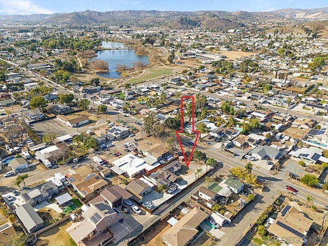 bird's eye view featuring a water and mountain view