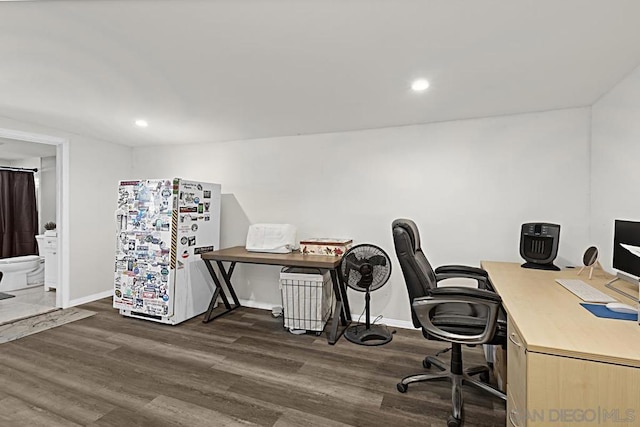 office with dark hardwood / wood-style flooring