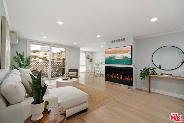 living room featuring expansive windows, crown molding, and light hardwood / wood-style flooring