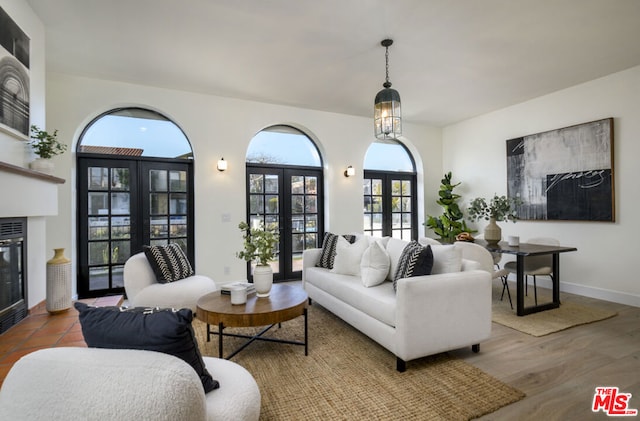 living room featuring wood-type flooring and french doors