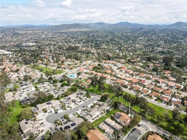 birds eye view of property with a mountain view