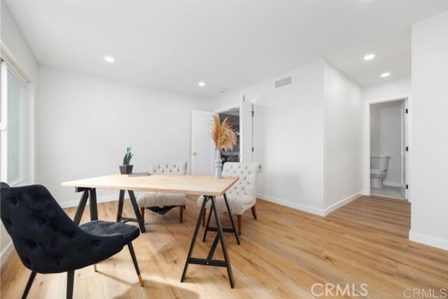 dining space featuring light wood-type flooring