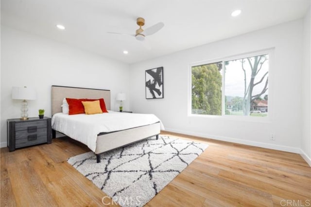 bedroom featuring hardwood / wood-style floors and ceiling fan