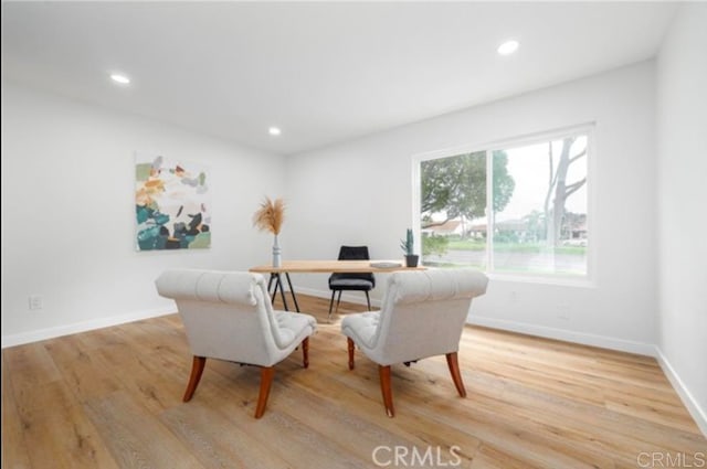 office space with light wood-type flooring