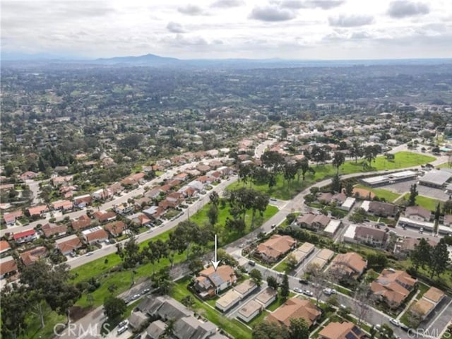 birds eye view of property with a mountain view