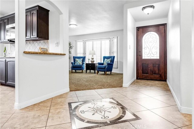 foyer with light tile patterned flooring