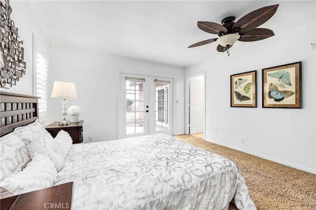 carpeted bedroom with access to exterior, ceiling fan, and french doors