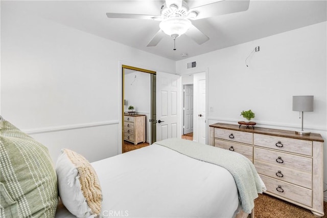 bedroom featuring ceiling fan and a closet