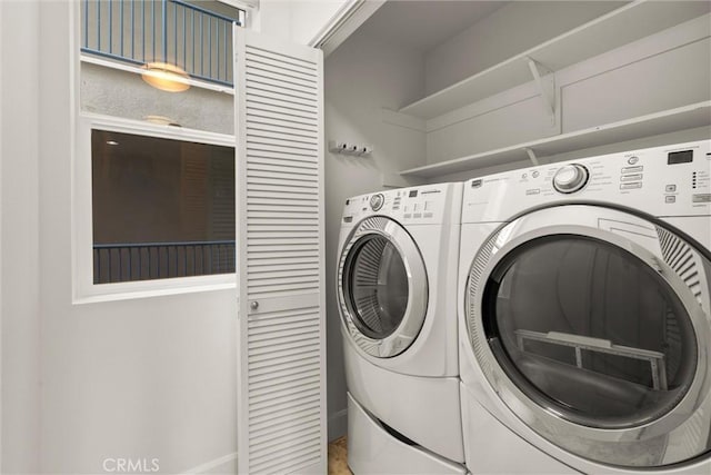 clothes washing area with washer and dryer