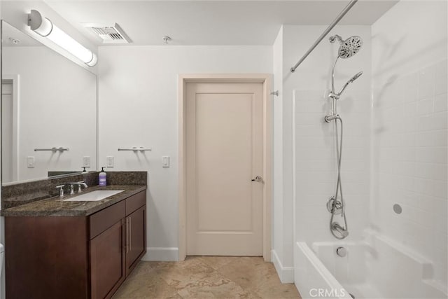 bathroom featuring vanity and washtub / shower combination