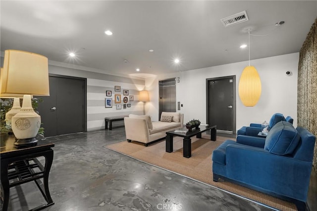 living room with concrete flooring