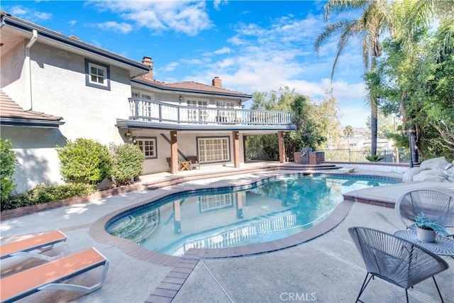 view of pool featuring a patio