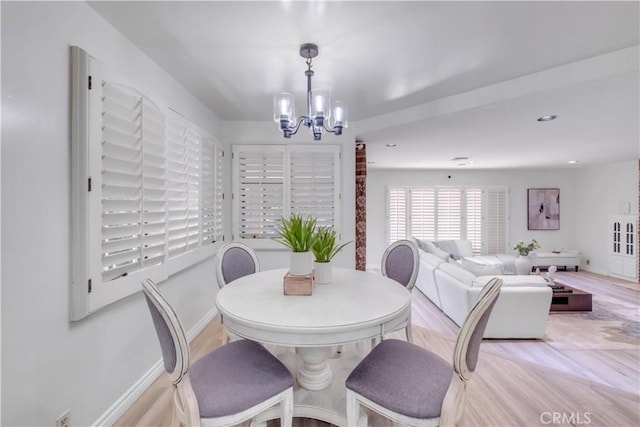 dining space featuring a notable chandelier