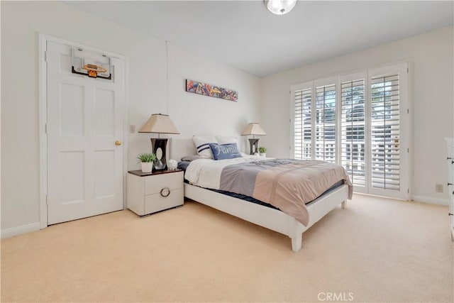 carpeted bedroom featuring access to exterior