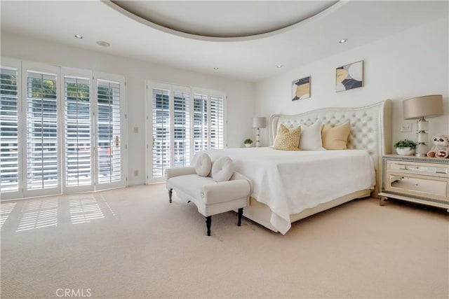 bedroom featuring access to outside and light colored carpet