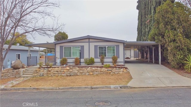 view of front of property with a carport