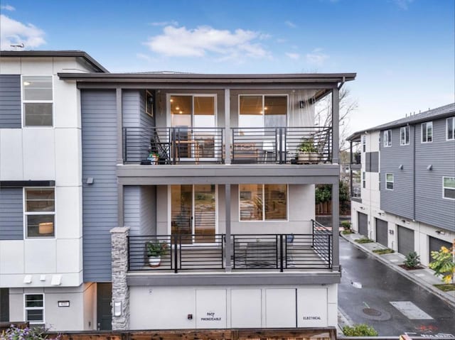 view of front of home with a balcony