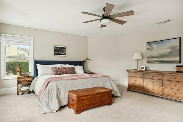 carpeted bedroom with ceiling fan