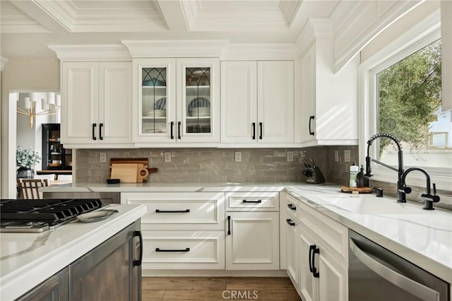 kitchen featuring light stone counters, sink, white cabinets, and appliances with stainless steel finishes