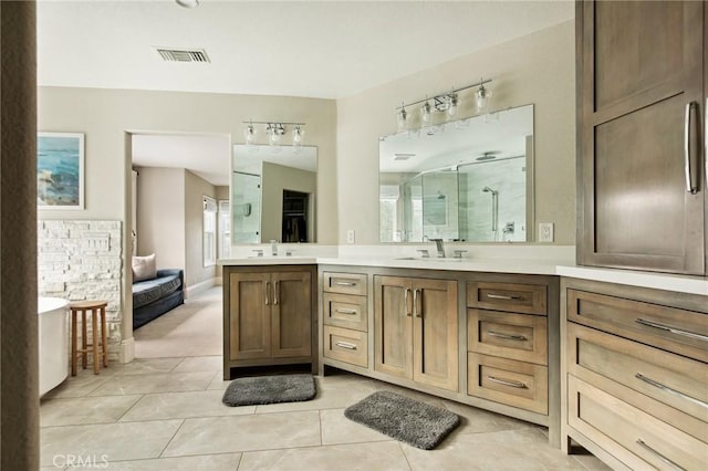 bathroom featuring vanity, tile patterned floors, and independent shower and bath