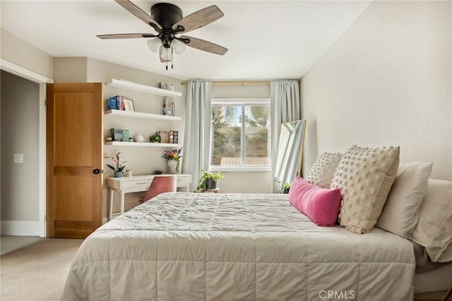 bedroom featuring ceiling fan and carpet