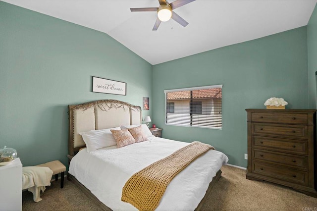 bedroom featuring vaulted ceiling, carpet floors, and ceiling fan