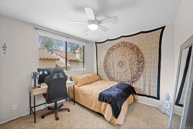 bedroom featuring light carpet and ceiling fan