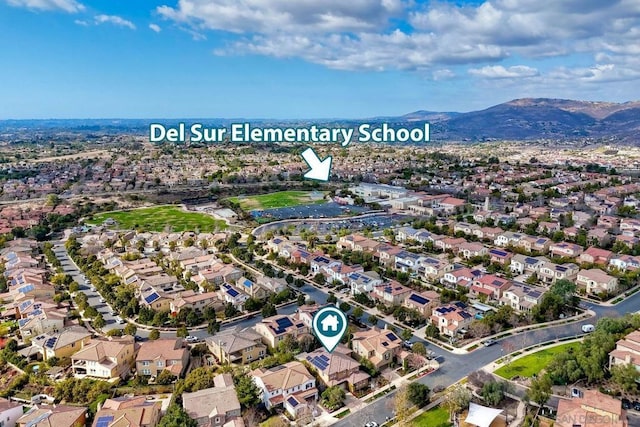 birds eye view of property with a mountain view