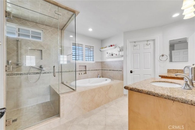 bathroom with vanity, tile patterned floors, and independent shower and bath