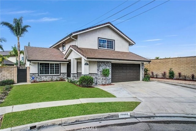 view of front property featuring a garage and a front yard