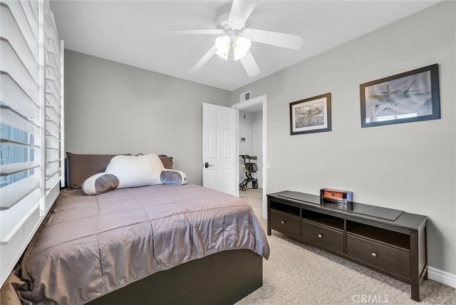 bedroom featuring light carpet and ceiling fan