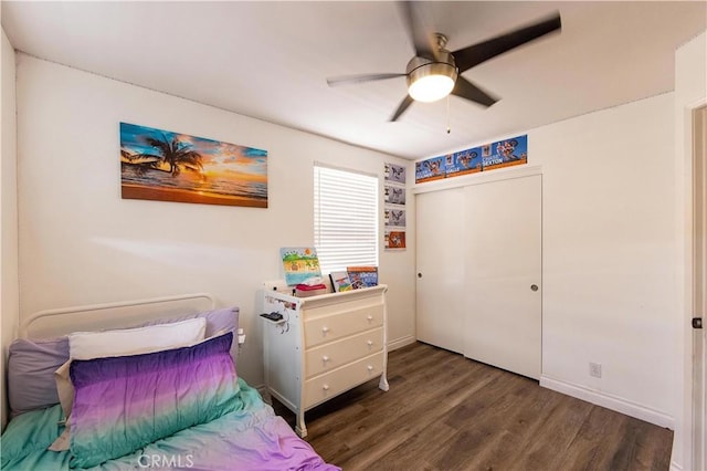 bedroom with dark hardwood / wood-style floors and ceiling fan