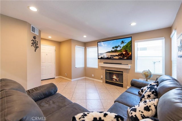 tiled living room with a tile fireplace