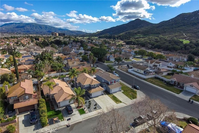 birds eye view of property with a mountain view