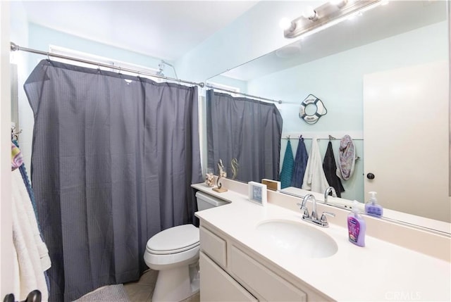 bathroom featuring vanity, tile patterned flooring, toilet, and a shower with shower curtain