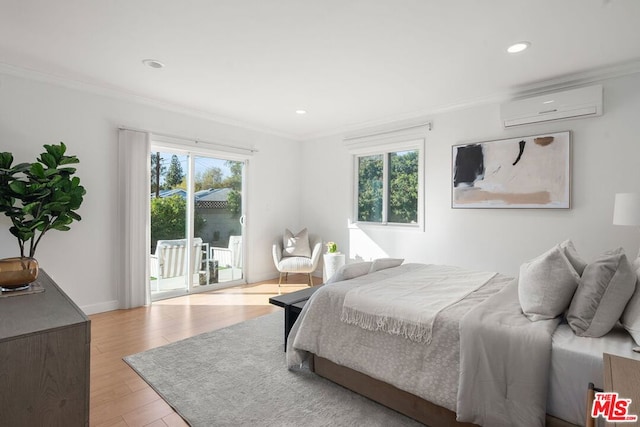 bedroom featuring crown molding, multiple windows, a wall unit AC, and access to outside