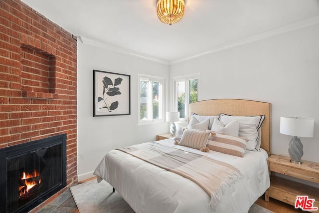 bedroom featuring a fireplace and ornamental molding