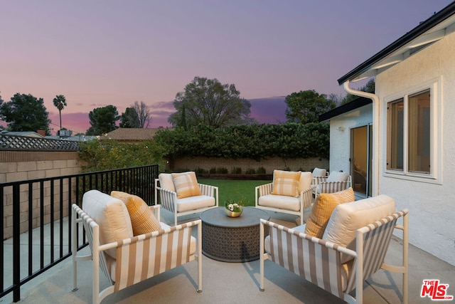 patio terrace at dusk with an outdoor hangout area