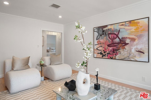 sitting room with crown molding