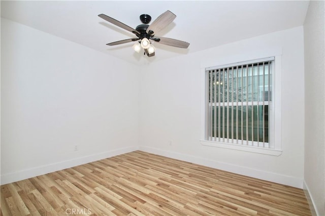 empty room with ceiling fan and light wood-type flooring