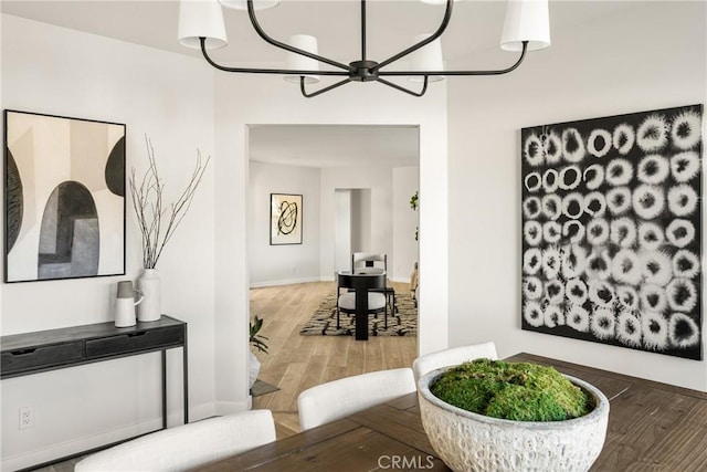 interior space featuring baseboards and wood finished floors