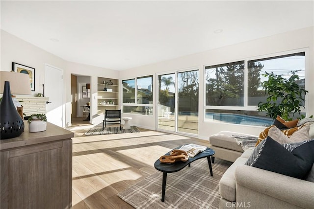 interior space featuring plenty of natural light, wood finished floors, and built in features